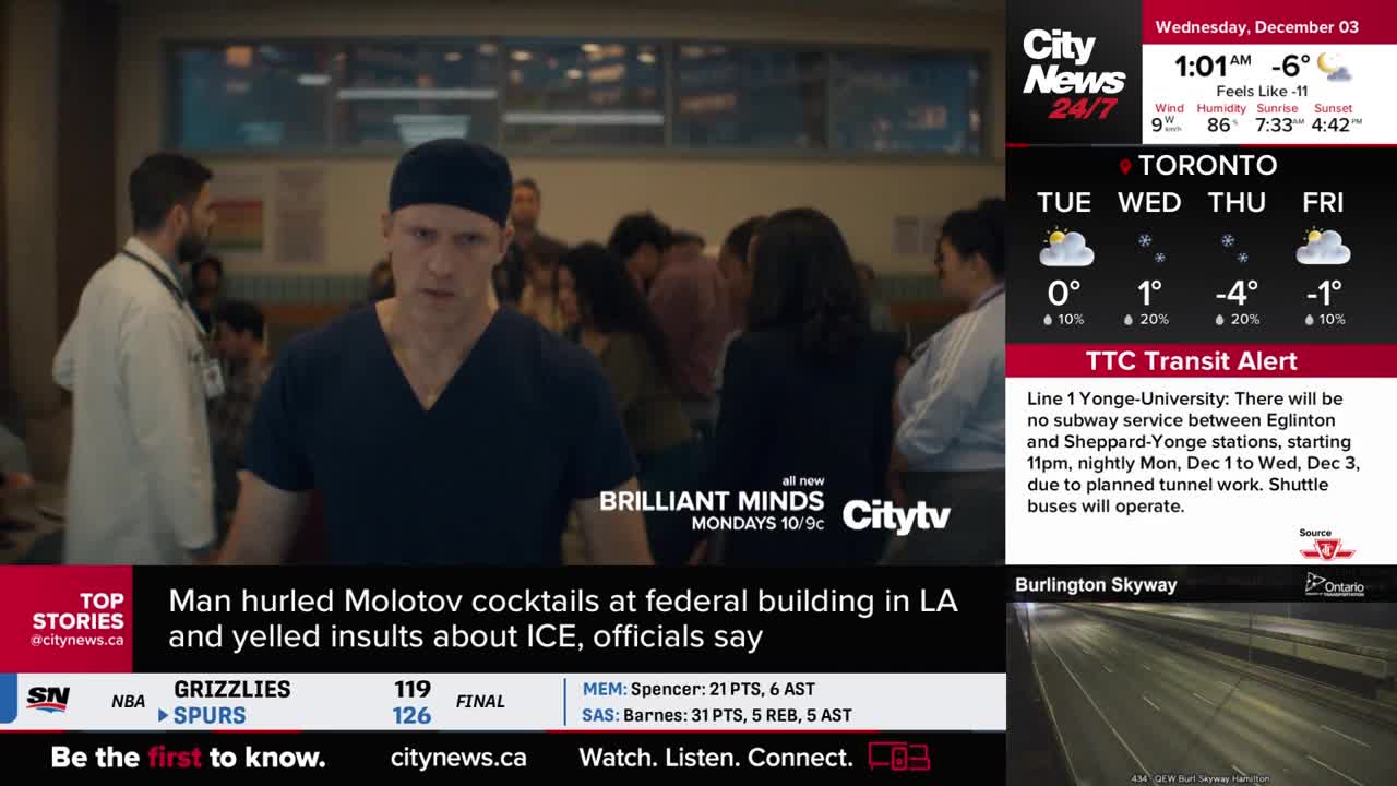 A man in scrubs and a cap looks directly at the camera, surrounded by other people in a brightly lit hallway. The CityNews Toronto logo and weather information for Toronto are visible on the right.
