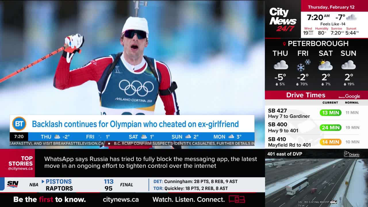 A biathlete with a white hat and sunglasses raises his ski poles in celebration. A news ticker below him reports on an Olympian's backlash.