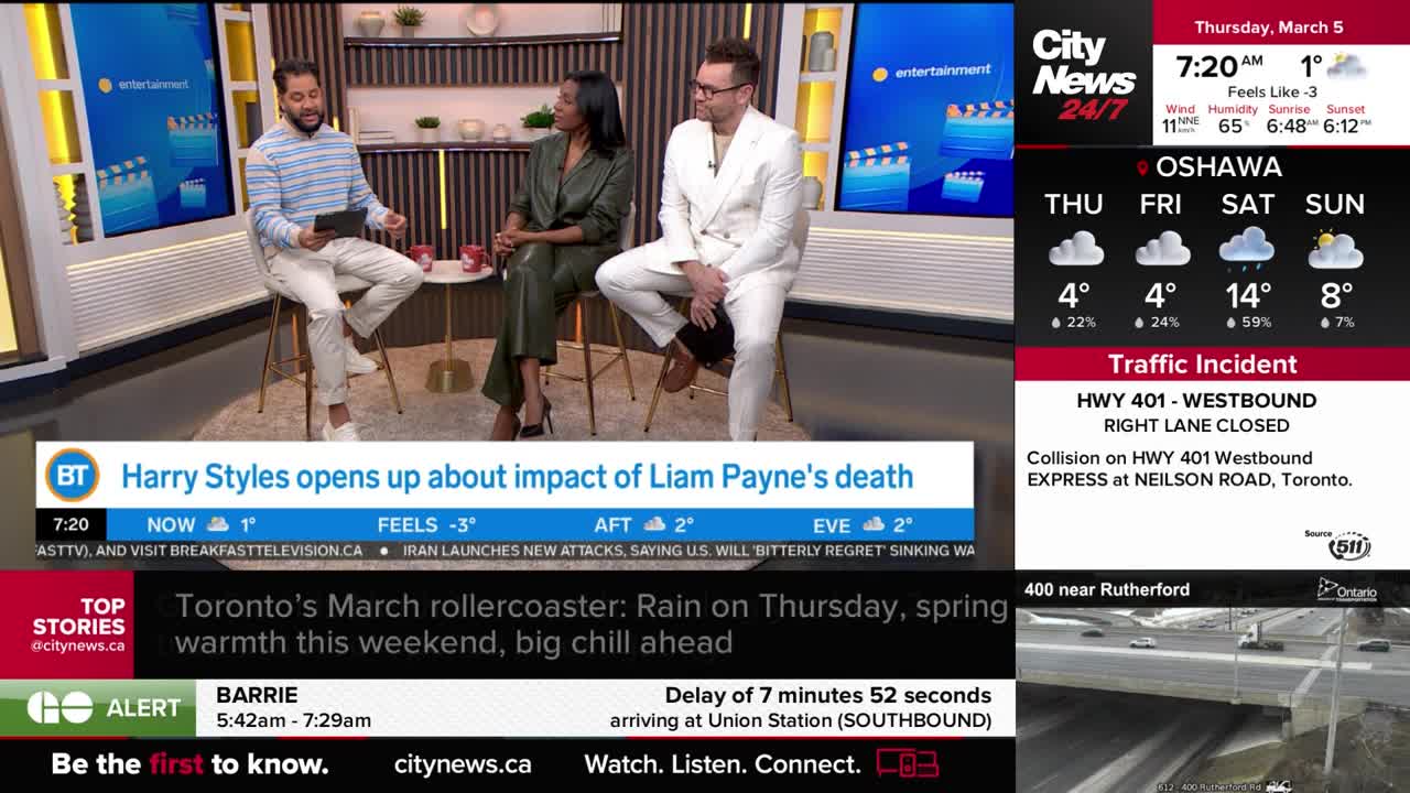 A news anchor in a white suit sits beside a woman in a green top. On the screen behind them, a graphic displays movie reels. To the right, a CityNews 24/7 overlay shows weather updates for Oshawa and a traffic incident on Highway 401.