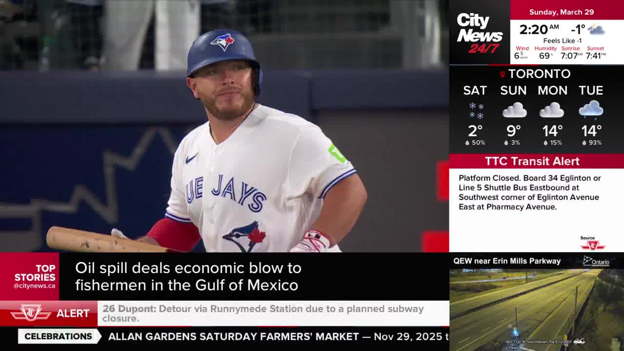 A Blue Jays player stands ready with his bat, his gaze fixed on something beyond the frame. The Toronto skyline is visible in the background, with a CityNews broadcast overlaying the scene.