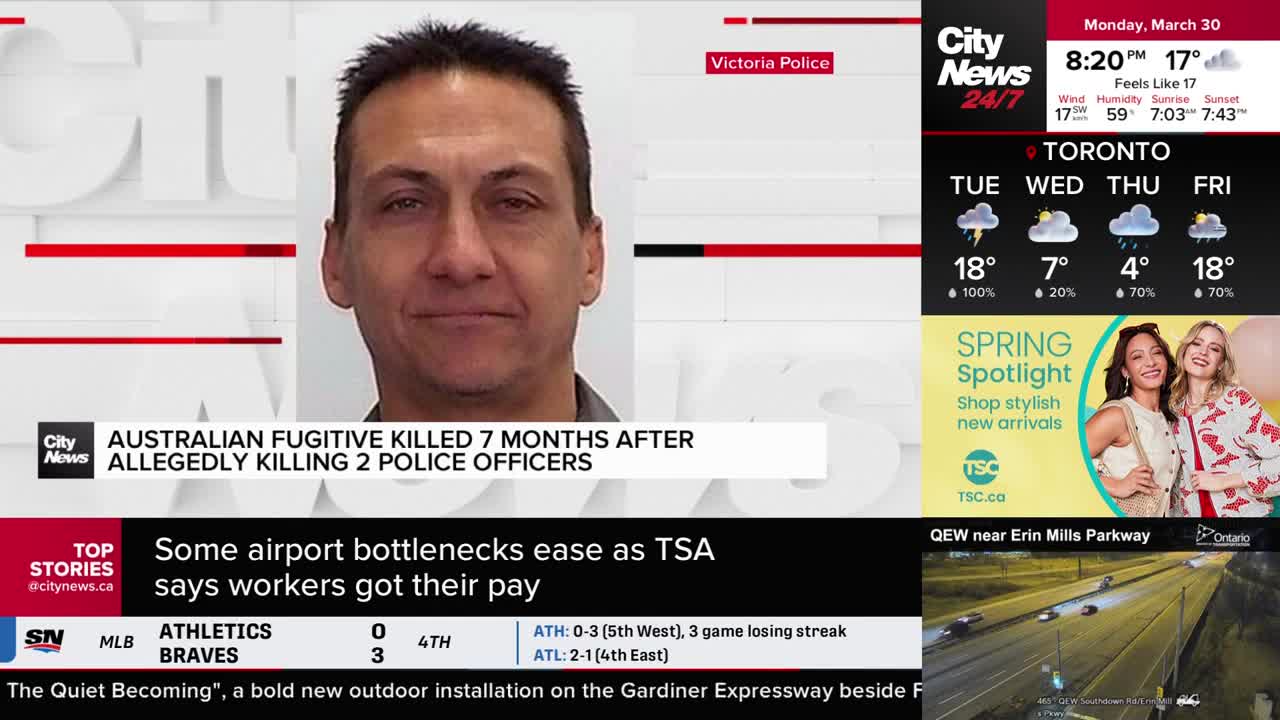 Cars are moving along the QEW near Erin Mills Parkway. The CityNews Toronto broadcast is showing a story about an Australian fugitive.