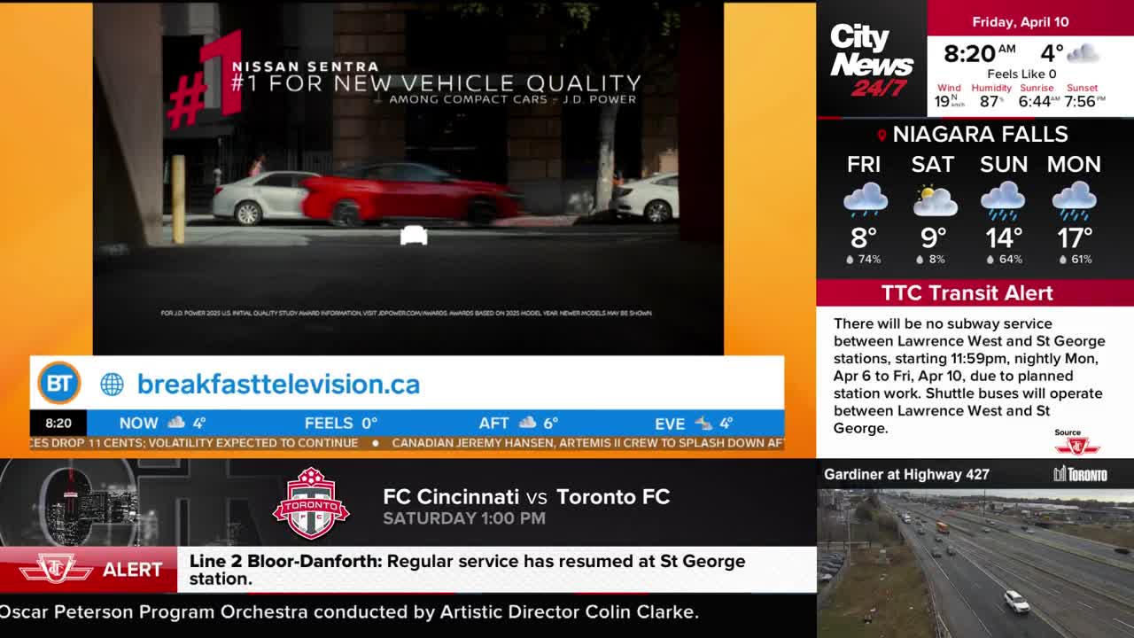 A red Nissan Sentra drives past a white one on a city street. The CityNews Toronto ticker shows a TTC transit alert for no subway service on Line 2. A red Nissan Sentra drives past a white one on a city street. The CityNews Toronto ticker shows a TTC transit alert for no subway service on Line 2.