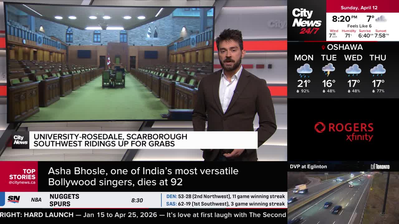 A reporter stands before a large screen displaying an empty legislative chamber. On the right, a CityNews Toronto weather forecast shows rain for Oshawa and a live traffic camera captures vehicles moving along a highway. A reporter stands before a large screen displaying an empty legislative chamber. On the right, a CityNews Toronto weather forecast shows rain for Oshawa and a live traffic camera captures vehicles moving along a highway.