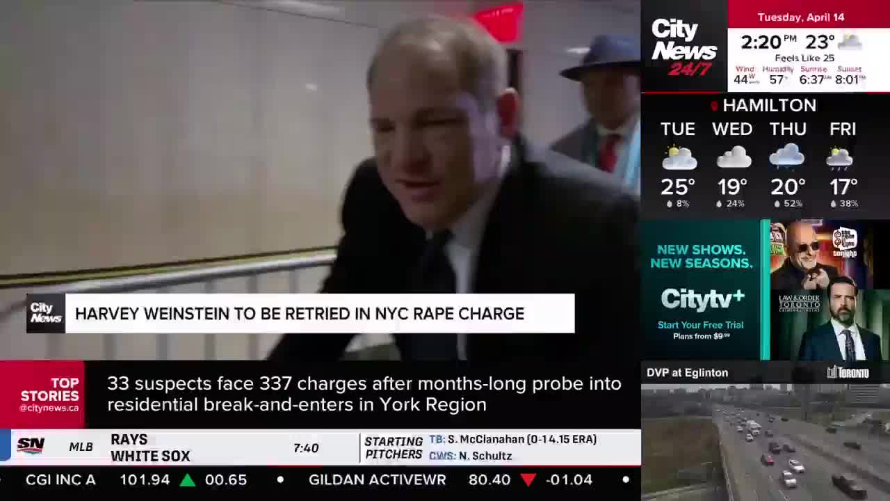 Harvey Weinstein walks down a hallway, his face grim. A headline on the screen announces he is to be retried in an NYC rape charge. Harvey Weinstein walks down a hallway, his face grim. A headline on the screen announces he is to be retried in an NYC rape charge.