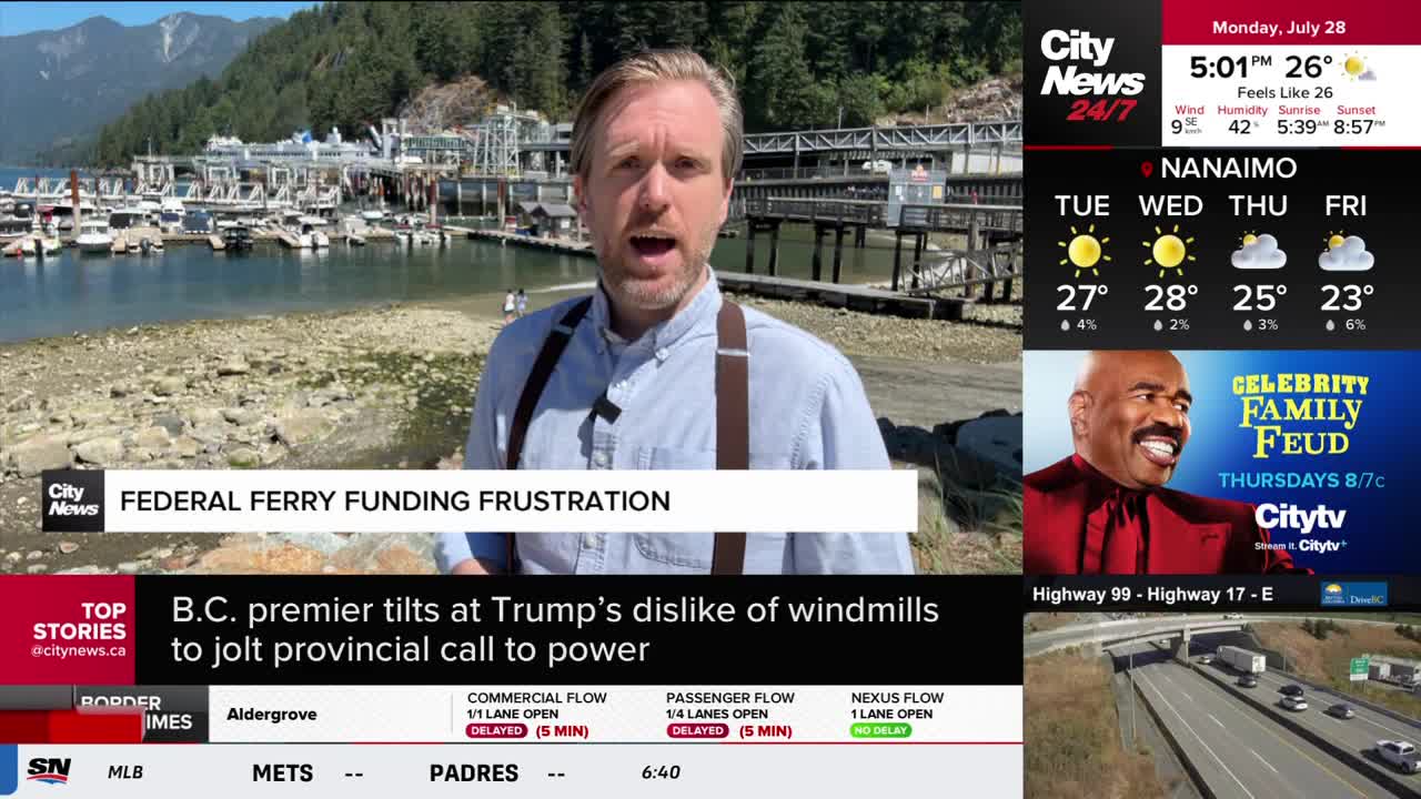 A CityNews Vancouver reporter, standing near a harbor, speaks directly to the camera. Behind him, boats bob gently in the water, and the sky is clear.
