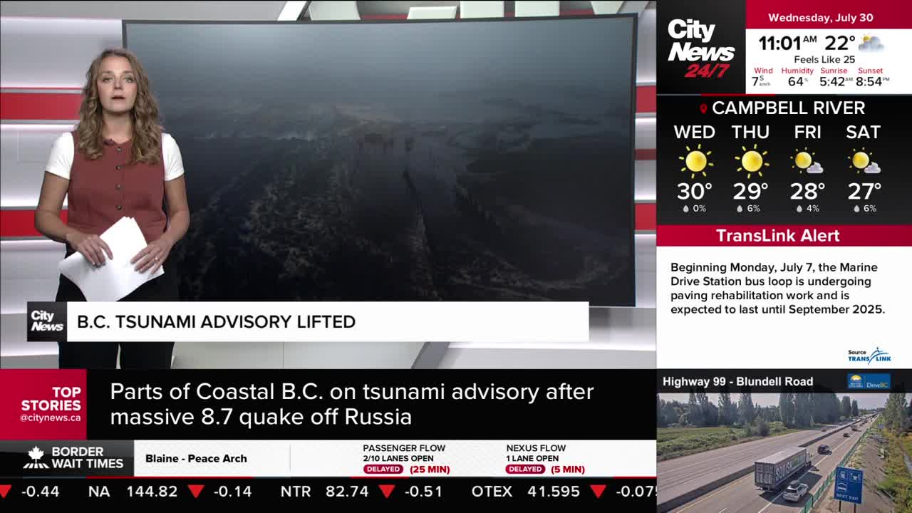 A CityNews Vancouver anchor stands in front of a screen, delivering a report. The headline "B.C. Tsunami Advisory Lifted" is displayed, with weather updates and traffic information on the right.
