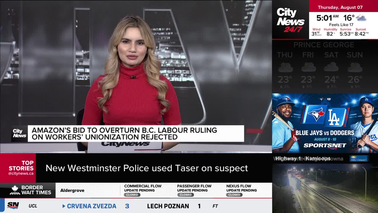 The CityNews Vancouver anchor, in a red turtleneck, is speaking directly to the camera. Headlines about Amazon and the police flash across the screen below her.
