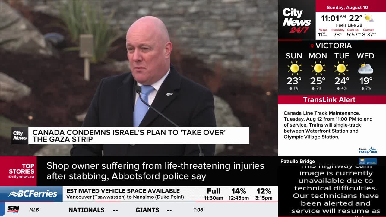A man in a suit and blue tie speaks into a microphone, the CityNews Vancouver logo visible beside him. The screen displays a headline: "Canada condemns Israel's plan to 'take over' the Gaza Strip."
