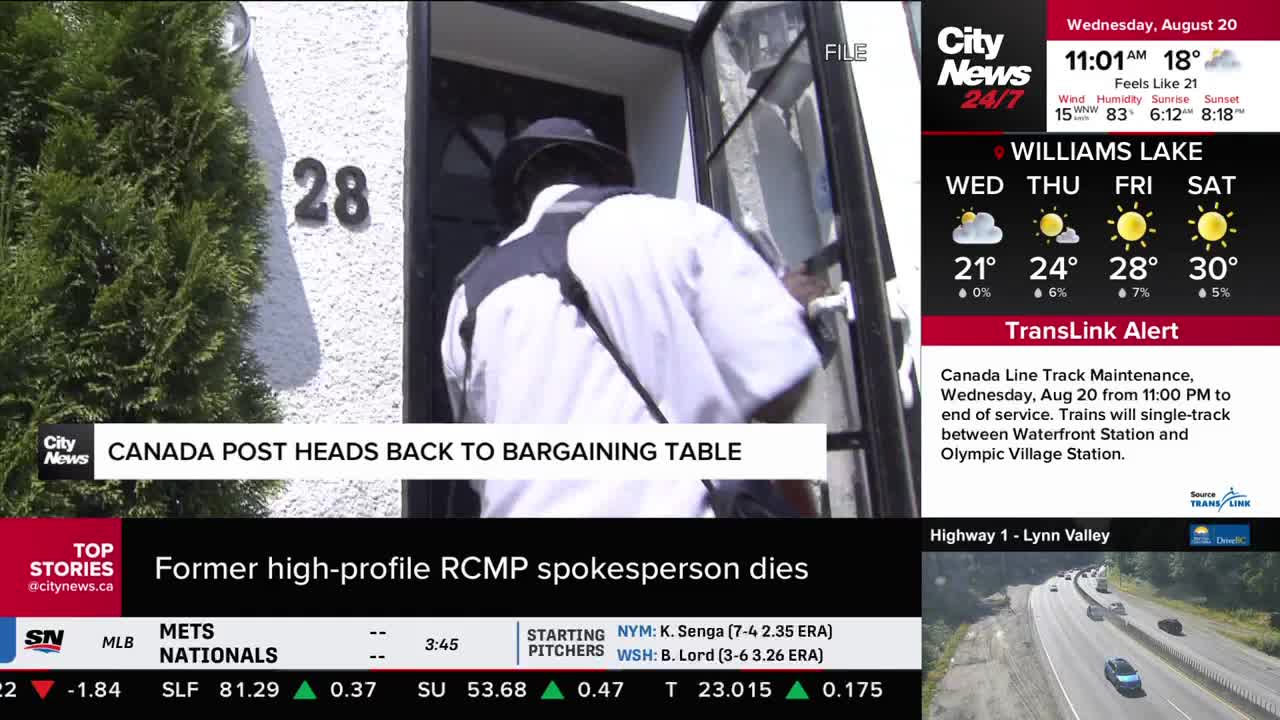 A person in a dark hat and uniform is entering a doorway, their back to the camera. The number "28" is visible on the building's exterior, as seen on CityNews Vancouver.
