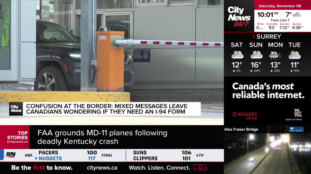 A dark SUV waits at a border crossing, its front end just beyond the orange arm. The CityNews Vancouver banner highlights confusion regarding I-94 forms for Canadians.
A dark SUV waits at a border crossing, its front end just beyond the orange arm. The CityNews Vancouver banner highlights confusion regarding I-94 forms for Canadians.