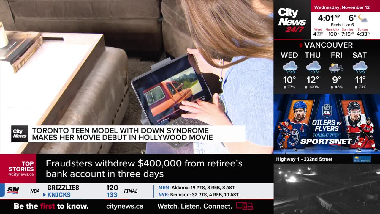 A woman holds a tablet, its screen displaying a scene with an orange truck. The CityNews Vancouver broadcast is running at the top of the screen.
A woman holds a tablet, its screen displaying a scene with an orange truck. The CityNews Vancouver broadcast is running at the top of the screen.