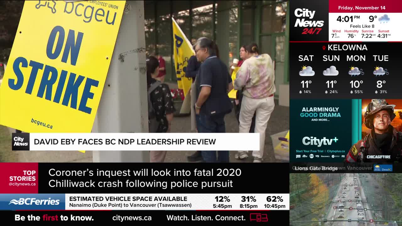 A large yellow sign reading "ON STRIKE" stands in the foreground, with a group of people gathered behind it. CityNews Vancouver's broadcast is running in the corner, with a weather report for Kelowna.
A large yellow sign reading "ON STRIKE" stands in the foreground, with a group of people gathered behind it. CityNews Vancouver's broadcast is running in the corner, with a weather report for Kelowna.