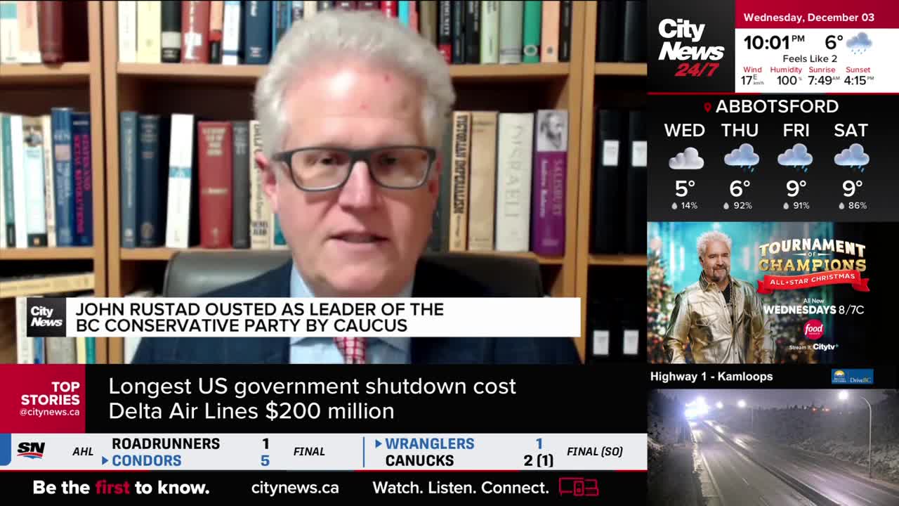A man in glasses is speaking, framed by a bookshelf, with the CityNews Vancouver logo in the corner. The headline below him announces John Rustad's ouster from the BC Conservative Party.
