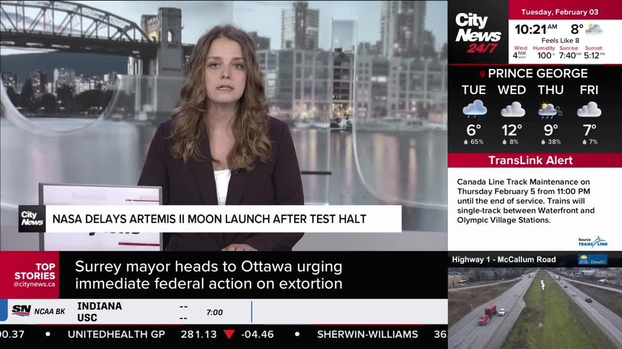 A news anchor reports on a NASA delay while a traffic camera shows vehicles moving along Highway 1 in British Columbia. A TransLink alert details Canada Line track maintenance for Thursday, February 5th.