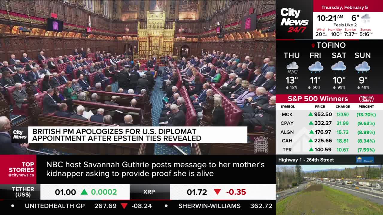 A man in a dark suit stands addressing a large assembly of people in ornate seating. The CityNews Vancouver screen displays a headline about the British PM apologizing.