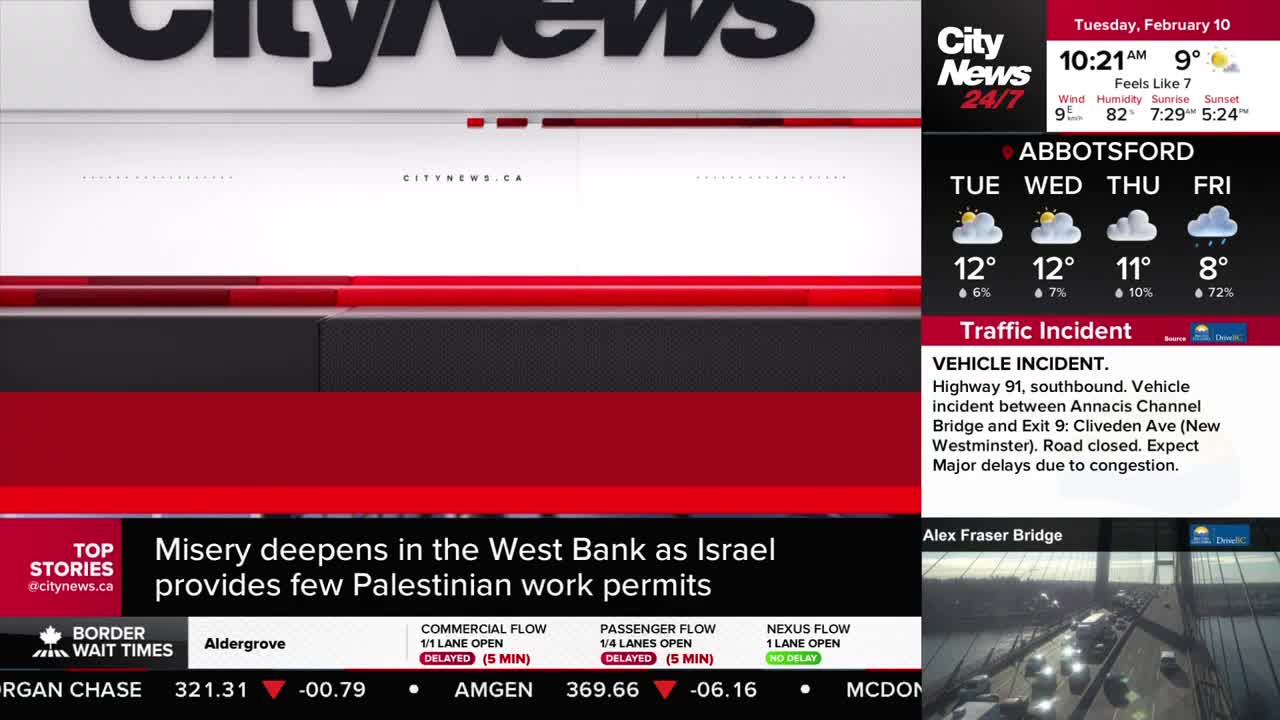 Traffic is backed up on the Alex Fraser Bridge. Cars are moving slowly over the span.