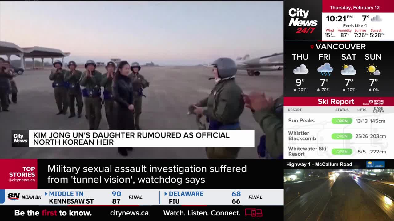 A woman in a dark outfit walks past a line of soldiers in military uniforms on an airfield. A plane sits in the background. A woman in a dark outfit walks past a line of soldiers in military uniforms on an airfield. A plane sits in the background.
