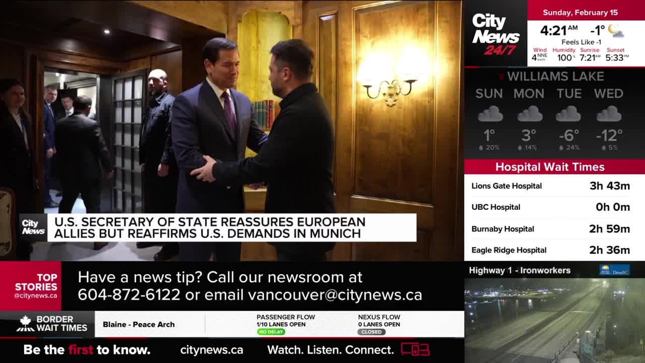 Two men in suits shake hands in a well-lit room. Behind them, other men in dark suits stand near an open doorway. Two men in suits shake hands in a well-lit room. Behind them, other men in dark suits stand near an open doorway.