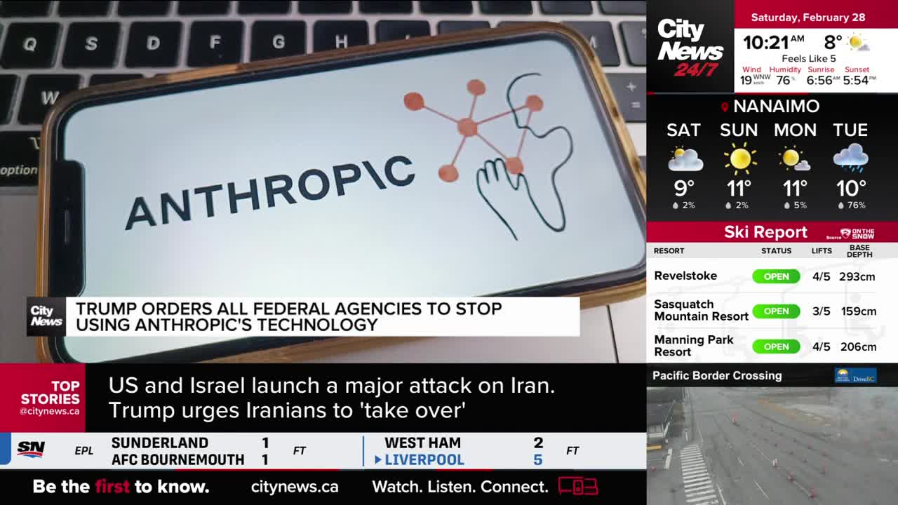 A smartphone displays "ANTHROPIC" with a network graphic, while a CityNews Vancouver broadcast scrolls headlines about US and Israeli actions in Iran and a ski report for local resorts. The screen also shows Nanaimo's weather forecast for the upcoming week. A smartphone displays "ANTHROPIC" with a network graphic, while a CityNews Vancouver broadcast scrolls headlines about US and Israeli actions in Iran and a ski report for local resorts. The screen also shows Nanaimo's weather forecast for the upcoming week.