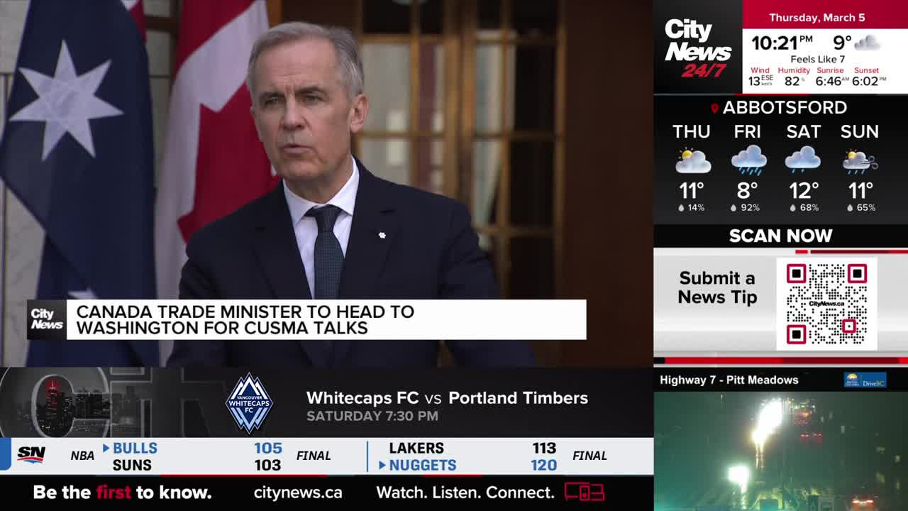 A man in a dark suit speaks at a podium, the Canadian flag behind him. On the screen, CityNews Vancouver reports the Canada Trade Minister is heading to Washington for CUSMA talks.
