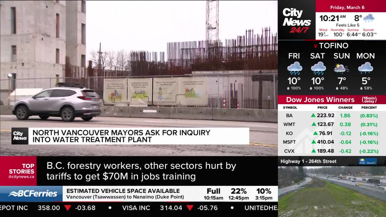 A silver SUV drives past a construction site for a water treatment plant in North Vancouver. On the screen, CityNews Vancouver reports that mayors are requesting an inquiry into the project.