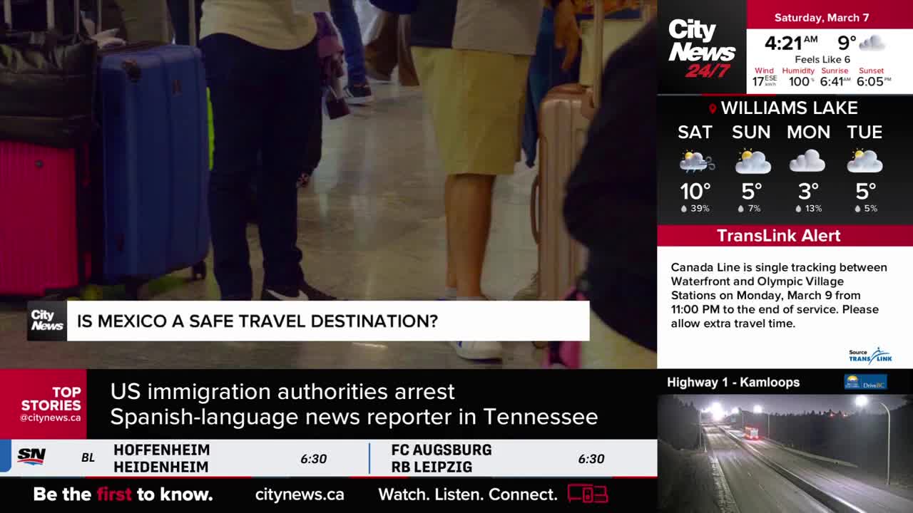 People stand with their luggage, waiting. A CityNews Vancouver alert indicates the Canada Line is single-tracking.