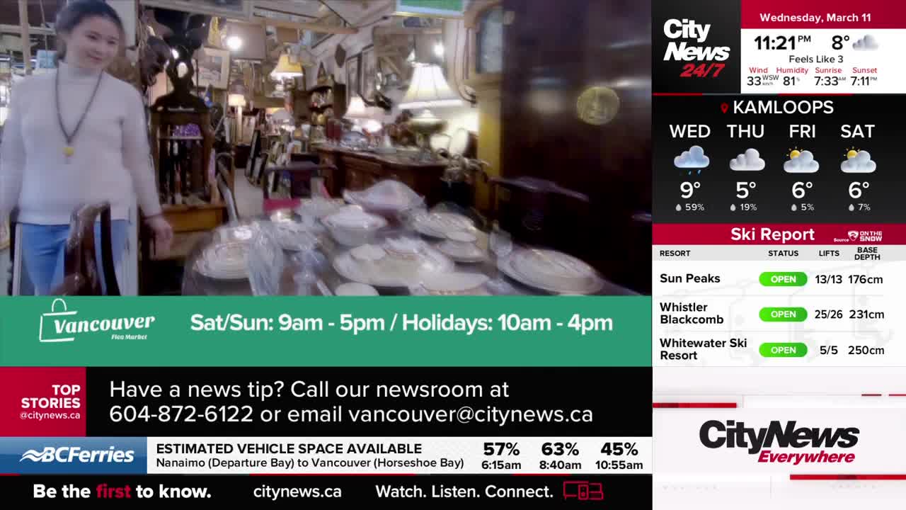 A woman in a white sweater walks through an antique shop, past tables laden with dishes. On the right, CityNews Vancouver displays a weather forecast for Kamloops and ski reports for local resorts.