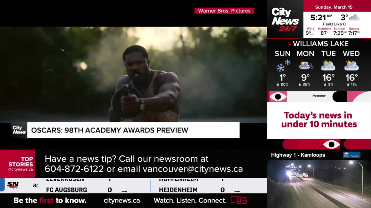A man with a determined expression aims a firearm forward, smoke billowing behind him. The CityNews Vancouver broadcast is showing a preview of the 98th Academy Awards. A man with a determined expression aims a firearm forward, smoke billowing behind him. The CityNews Vancouver broadcast is showing a preview of the 98th Academy Awards.