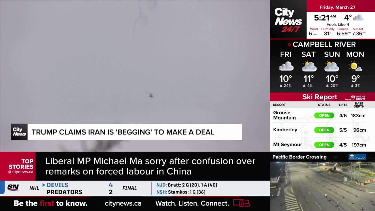 A small helicopter hovers against a hazy sky. Below it, a news ticker scrolls with headlines from CityNews Vancouver.
