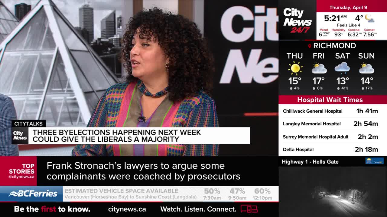 A woman with curly hair speaks animatedly, wearing a colourful patterned top. Beside her, a screen displays news headlines and weather forecasts for the Vancouver area.