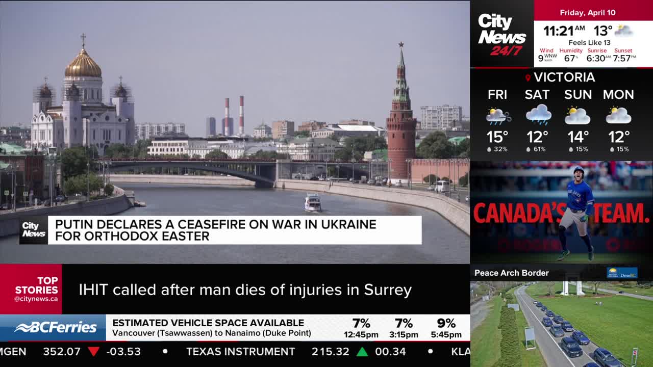 A white boat glides down a wide river, passing under a bridge. Across the water, a large cathedral with a golden dome stands beside a red tower.