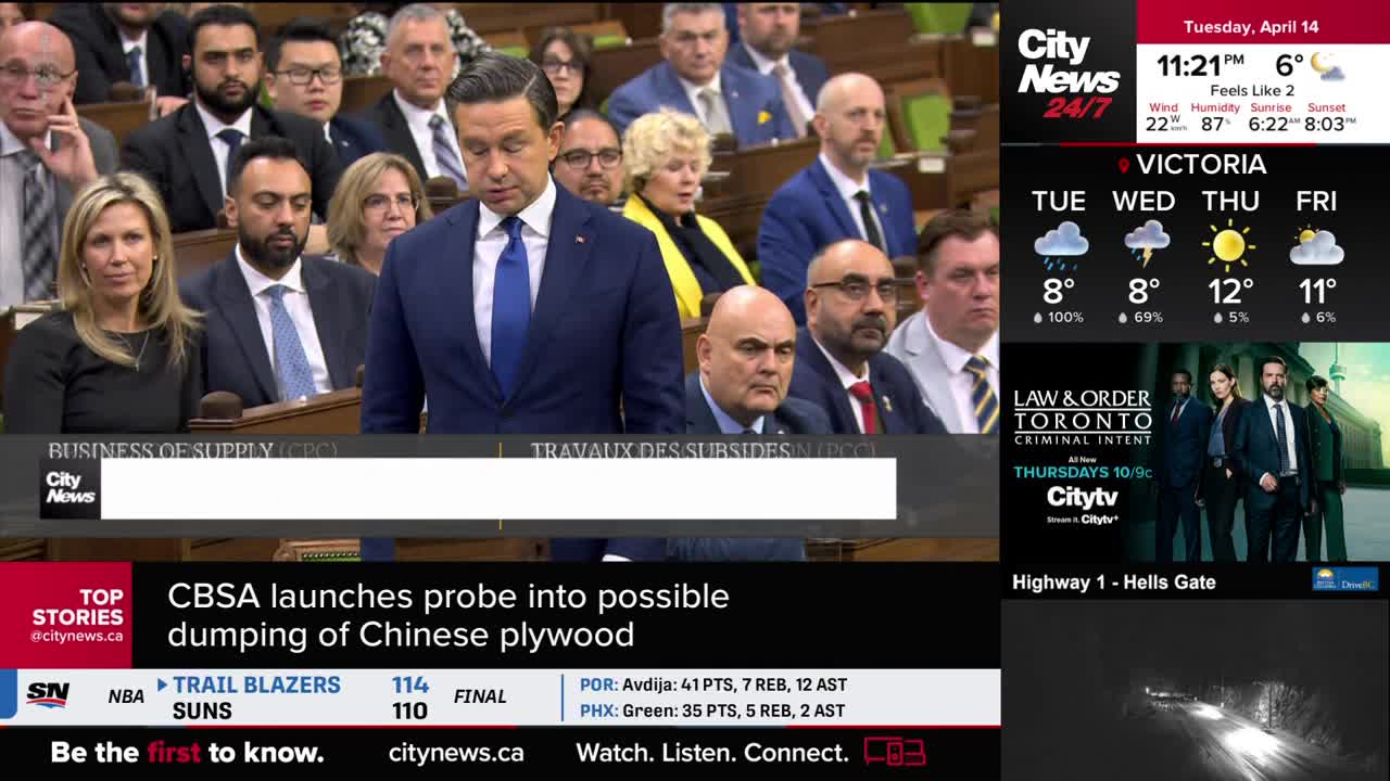 A man in a blue suit and tie stands at a podium, speaking to a room full of people in Parliament. A CityNews Vancouver ticker at the bottom reports on a CBSA probe into Chinese plywood.