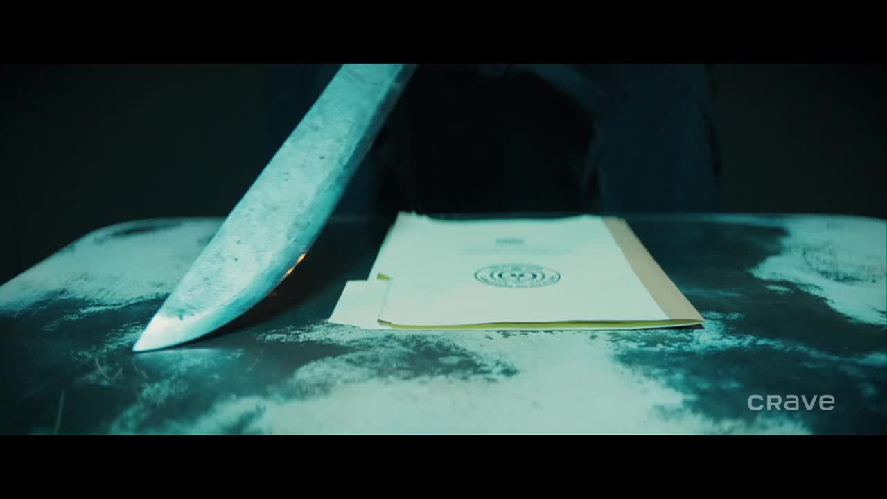 A large blade hovers over a file, its edge reflecting the dim, blue light. The documents rest on a shiny surface, the Crave logo visible in the corner.
