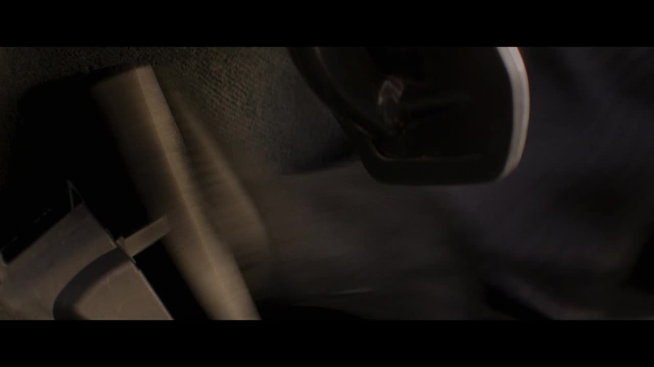 The interior of a car is visible, with the dashboard and a seatbelt buckle in the foreground. The scene is dimly lit, suggesting a night scene, perhaps from a Canadian production on Crave 2.
