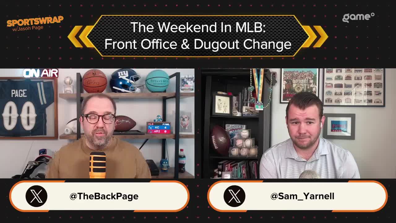 Two men are seated at their desks, microphones in front of them, discussing "The Weekend In MLB" on Game+ from Canada. The set is decorated with sports memorabilia, and the screen displays the show's title.

