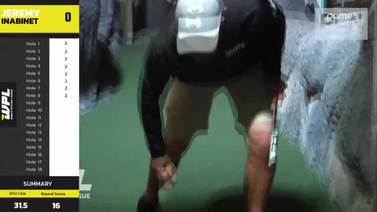 A player, Jeremy Inabinet, is hunched over, seemingly preparing to putt on a course. The Game+ logo is visible, and the scoreboard shows his score.
