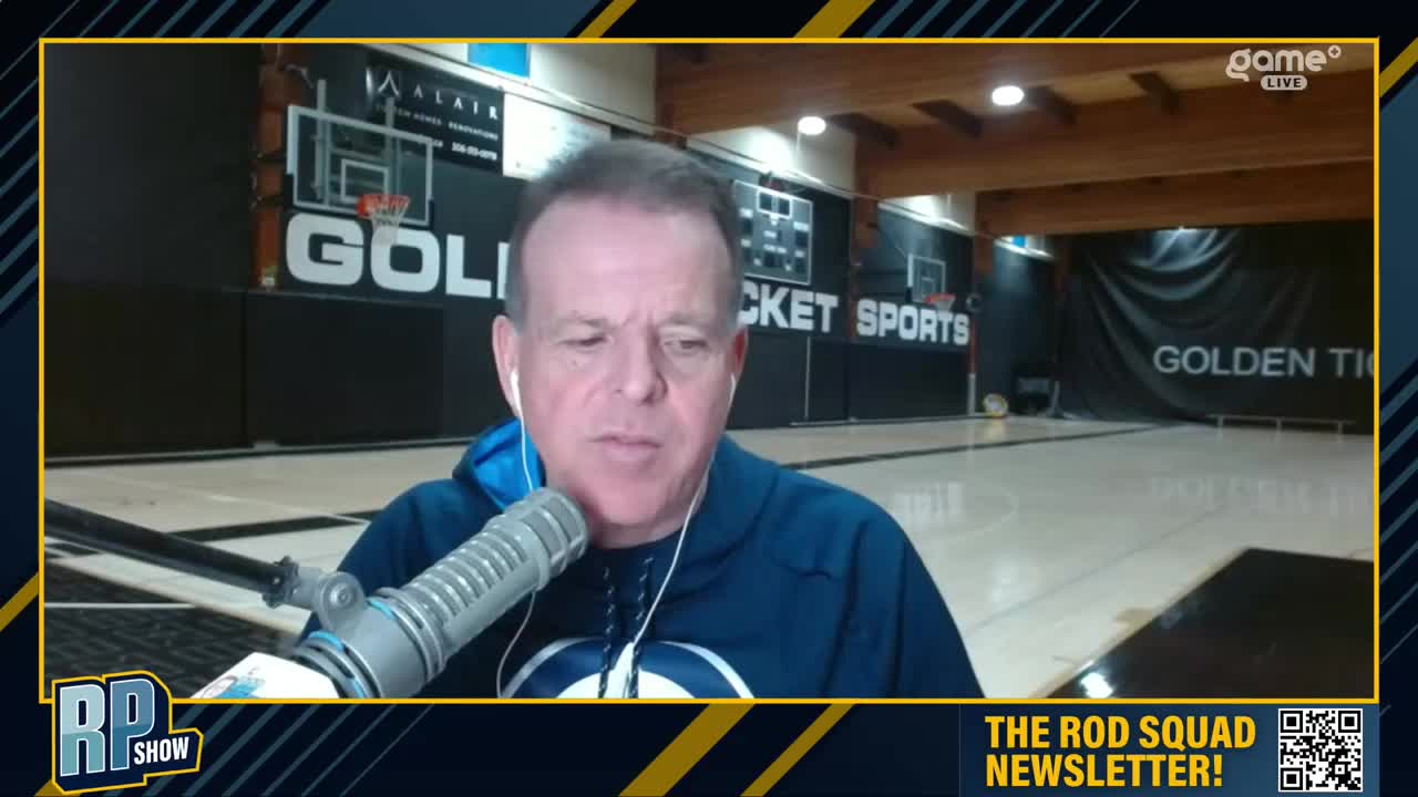 The man in the blue hoodie speaks into a microphone, his image framed by a Game+ graphic. Behind him, a basketball court is visible, with "Golden Ticket" emblazoned on a banner.
