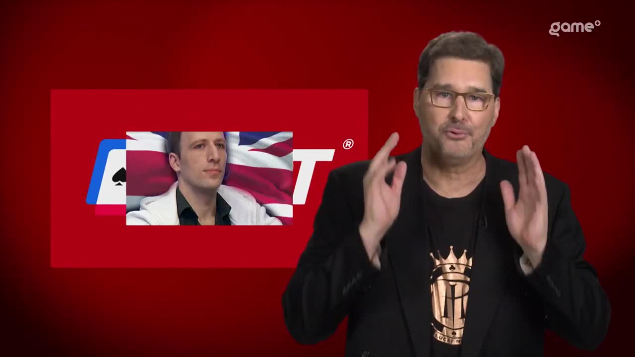 A man in a suit gestures with his hands while a graphic behind him displays an ace of spades and a portion of the Union Jack. The Game+ logo appears in the corner. A man in a suit gestures with his hands while a graphic behind him displays an ace of spades and a portion of the Union Jack. The Game+ logo appears in the corner.