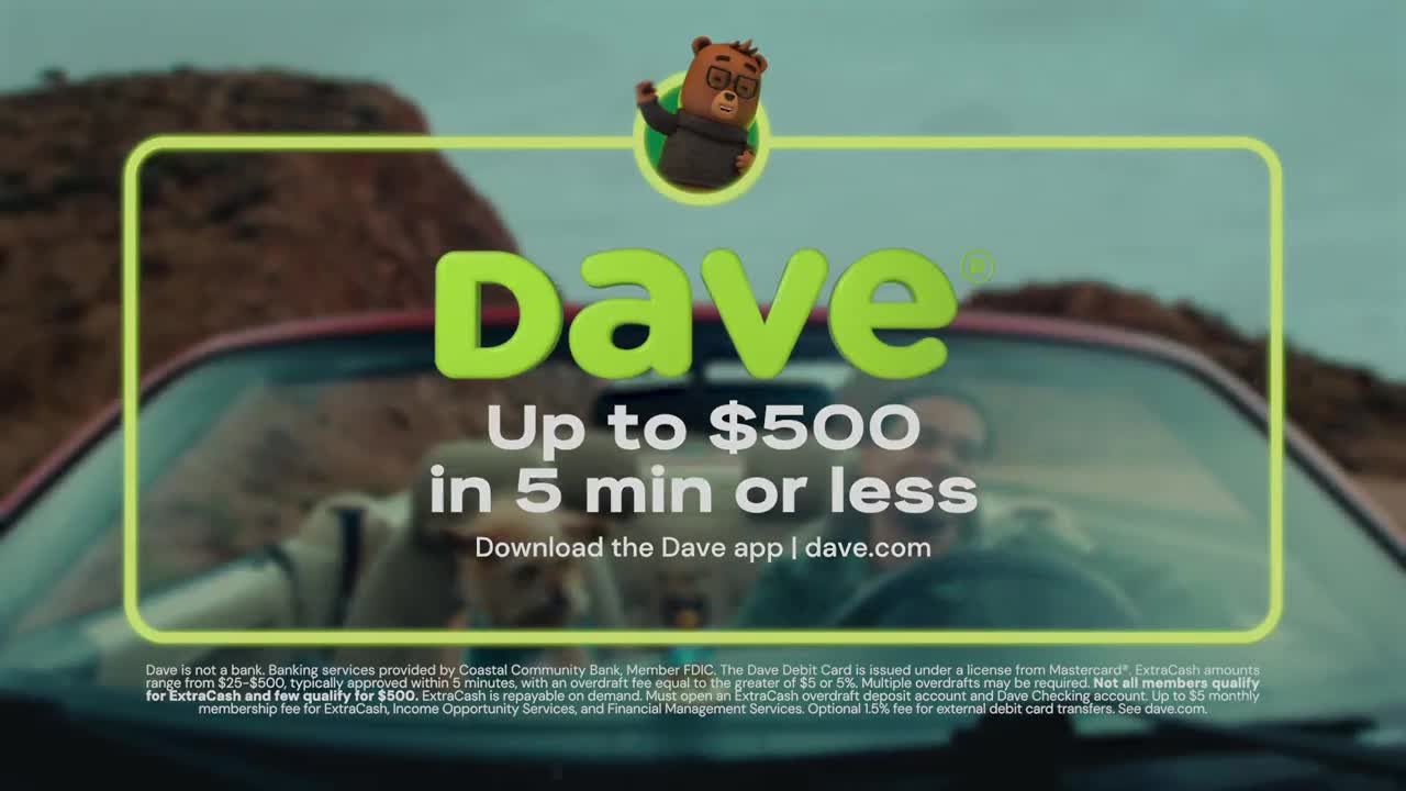 The red convertible is moving, the driver's face is blurred behind the steering wheel. A cartoon bear in glasses waves from above the windshield. The red convertible is moving, the driver's face is blurred behind the steering wheel. A cartoon bear in glasses waves from above the windshield.