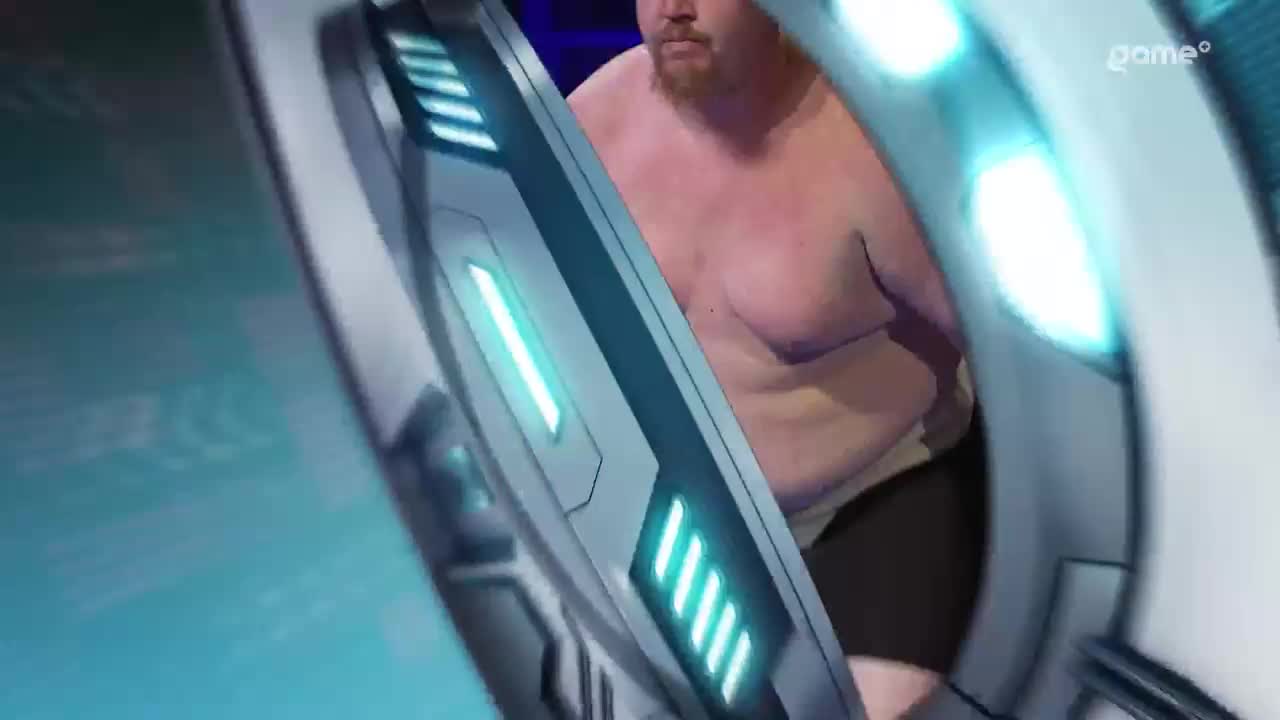 A man with a beard stands inside a futuristic-looking pod, its blue lights glowing. This is part of the Game+ broadcast from Canada. A man with a beard stands inside a futuristic-looking pod, its blue lights glowing. This is part of the Game+ broadcast from Canada.