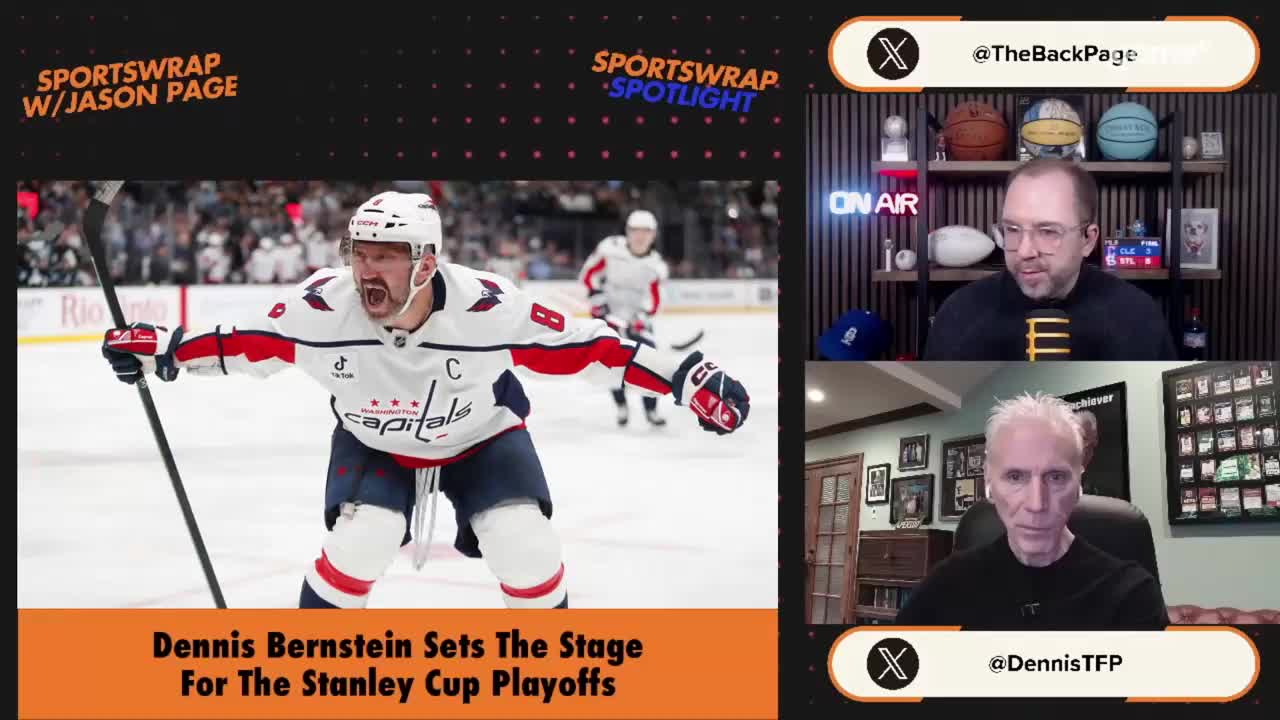 A hockey player in a white Capitals jersey with red and blue trim is celebrating on the ice, stick raised. Two men are on a video call, one with a microphone and the other looking intently at the camera.