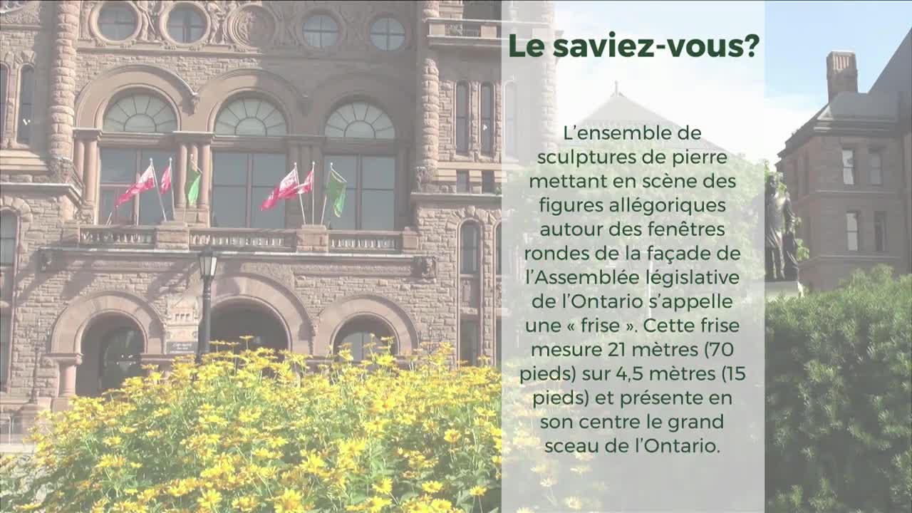 The Ontario Legislative Assembly building stands tall, flags of red and green waving gently in the breeze. Yellow flowers fill the foreground, framing the stone facade.
