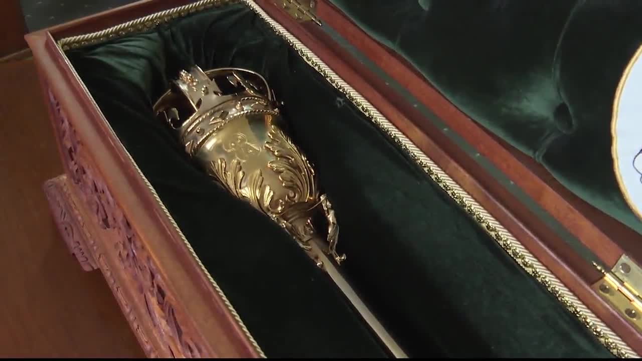 Inside a wooden case, the golden Mace of the Legislative Assembly of Ontario rests on a bed of green velvet. The ornate, ceremonial object is ready for its next use.
