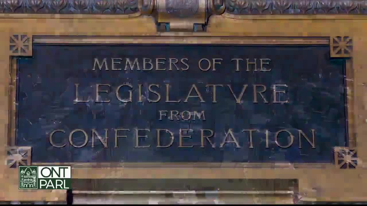 The words "Members of the Legislature from Confederation" are etched in gold against a dark plaque, likely within the Legislative Assembly of Ontario. The ornate frame and the "ONT PARL" logo in the corner suggest a formal setting, a place of history in Canada.
