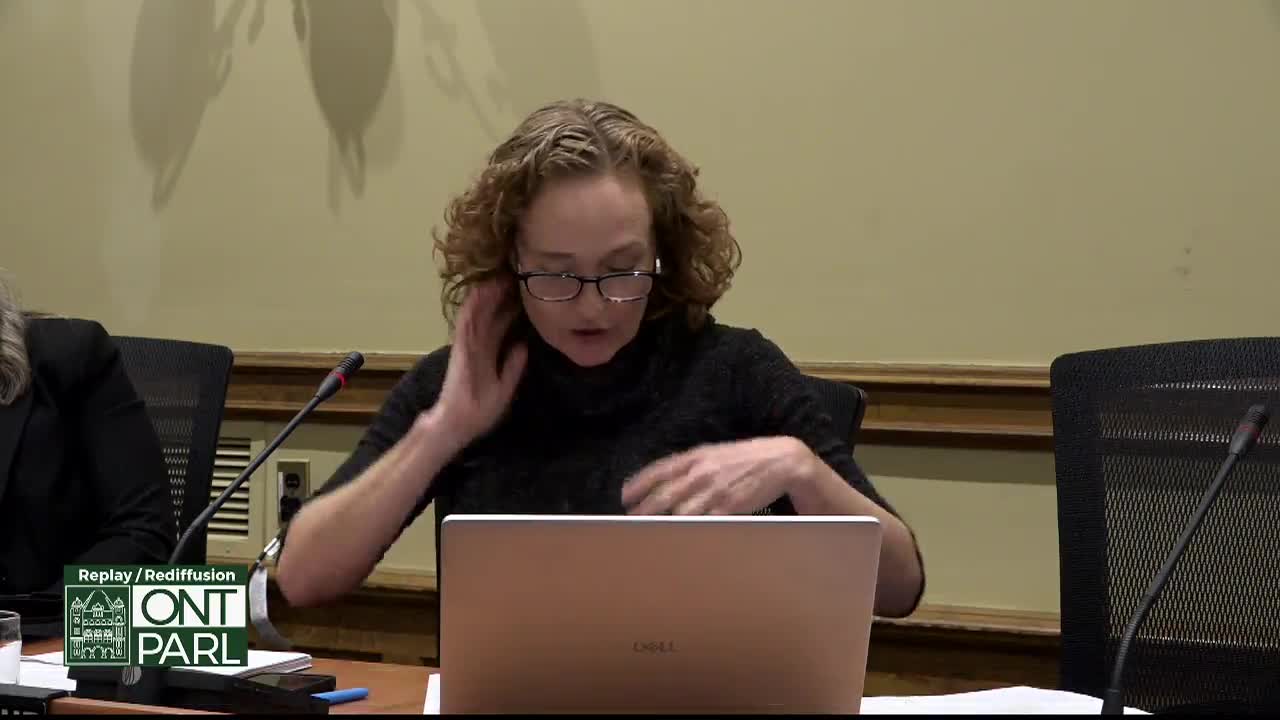 In a room at the Legislative Assembly of Ontario, a woman with curly hair and glasses adjusts her hair while looking down at a laptop. A microphone sits in front of her, and the logo for Ontario Parliament is in the corner.
In a room at the Legislative Assembly of Ontario, a woman with curly hair and glasses adjusts her hair while looking down at a laptop. A microphone sits in front of her, and the logo for Ontario Parliament is in the corner.