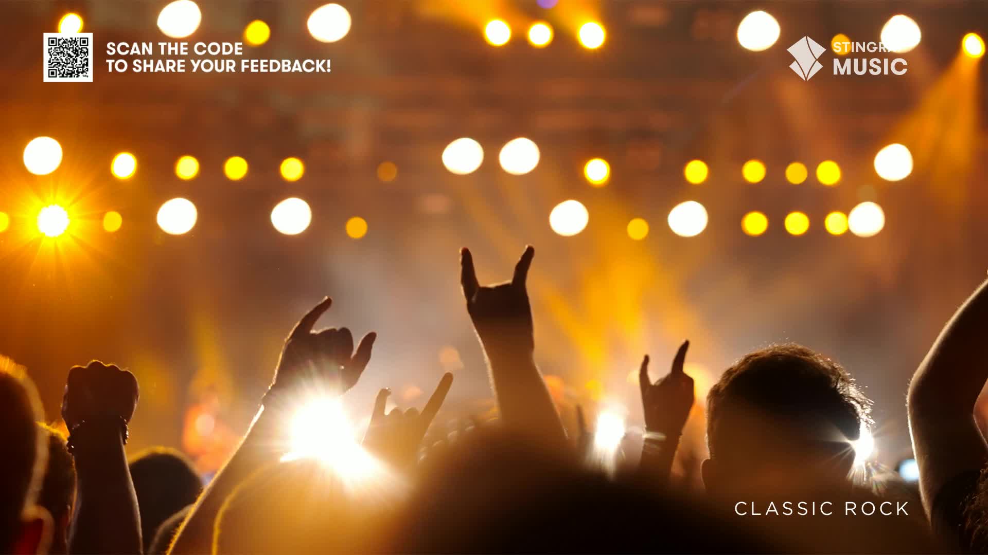 The crowd is a sea of raised hands, many flashing the "rock on" sign towards the stage. Above, the lights blaze, bathing the scene in a warm glow, as Stingray Classic Rock fills the air.
