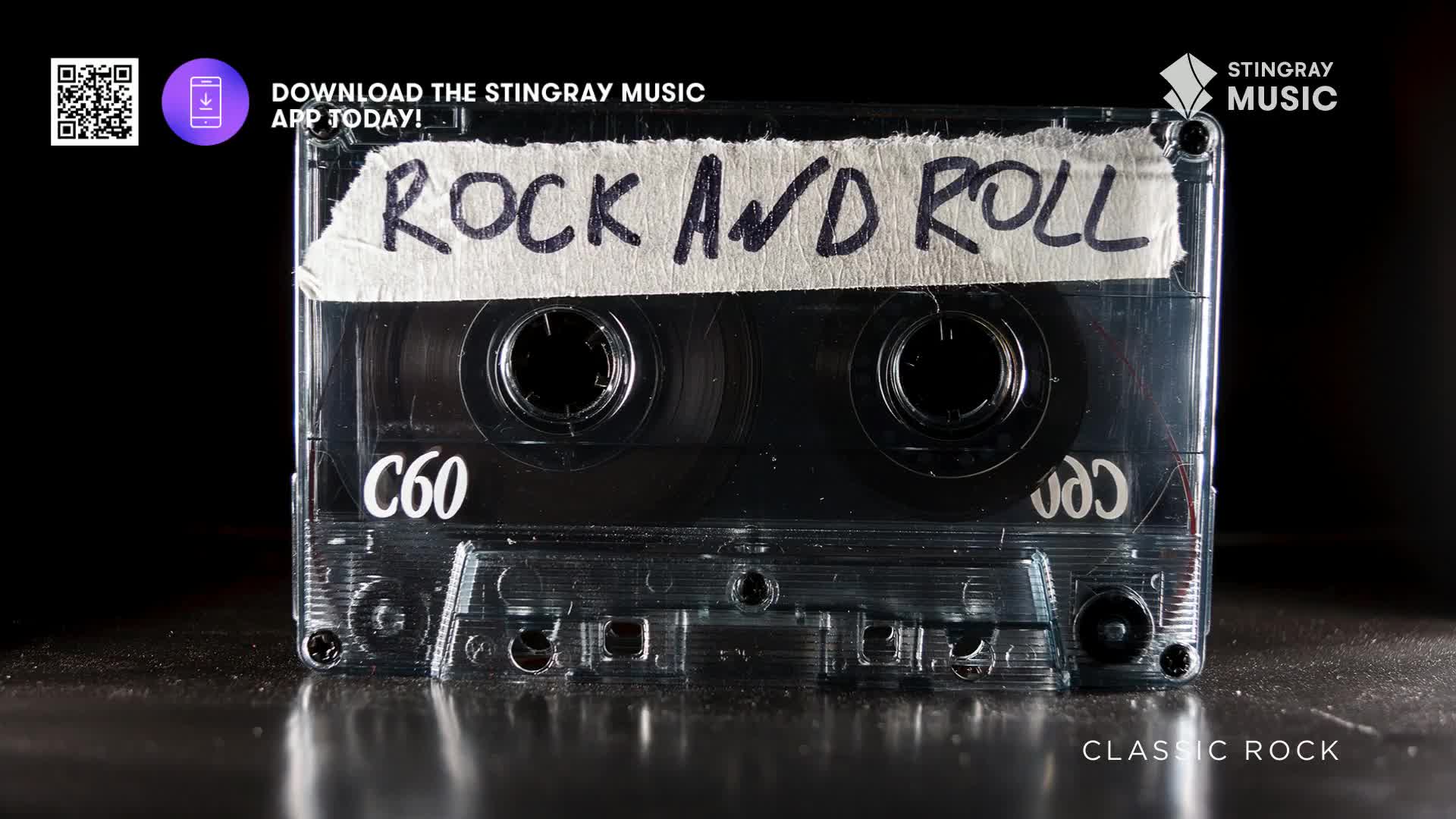 A clear cassette tape, labeled "Rock and Roll," sits on a reflective surface, likely promoting Stingray Classic Rock from Canada. The tape's spools are visible, and the C60 label suggests a full album's worth of tunes.
