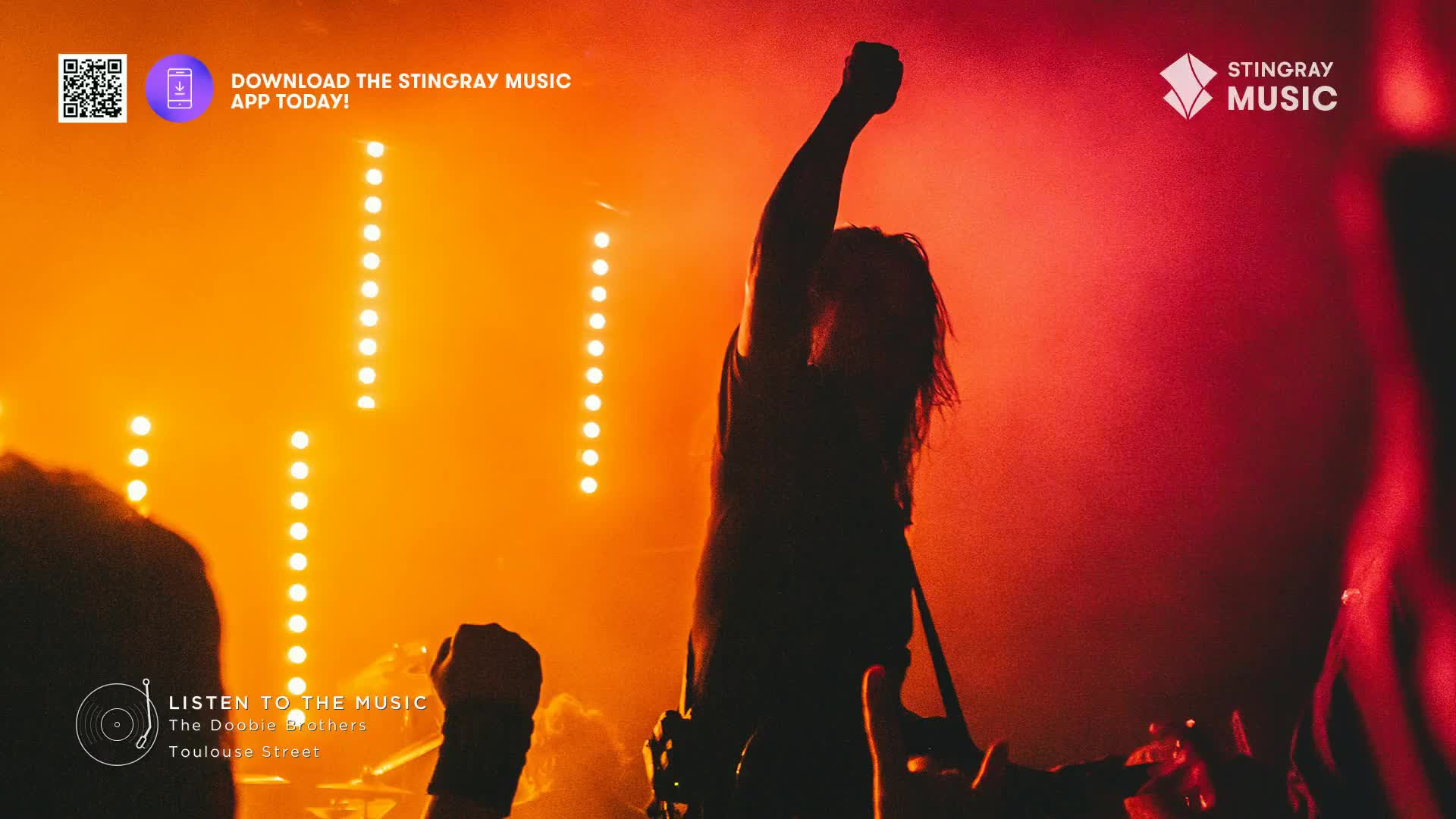 The singer, backlit by orange stage lights, has one fist raised high. Below, the crowd's hands are up, too, all caught up in the Stingray Classic Rock vibe.
