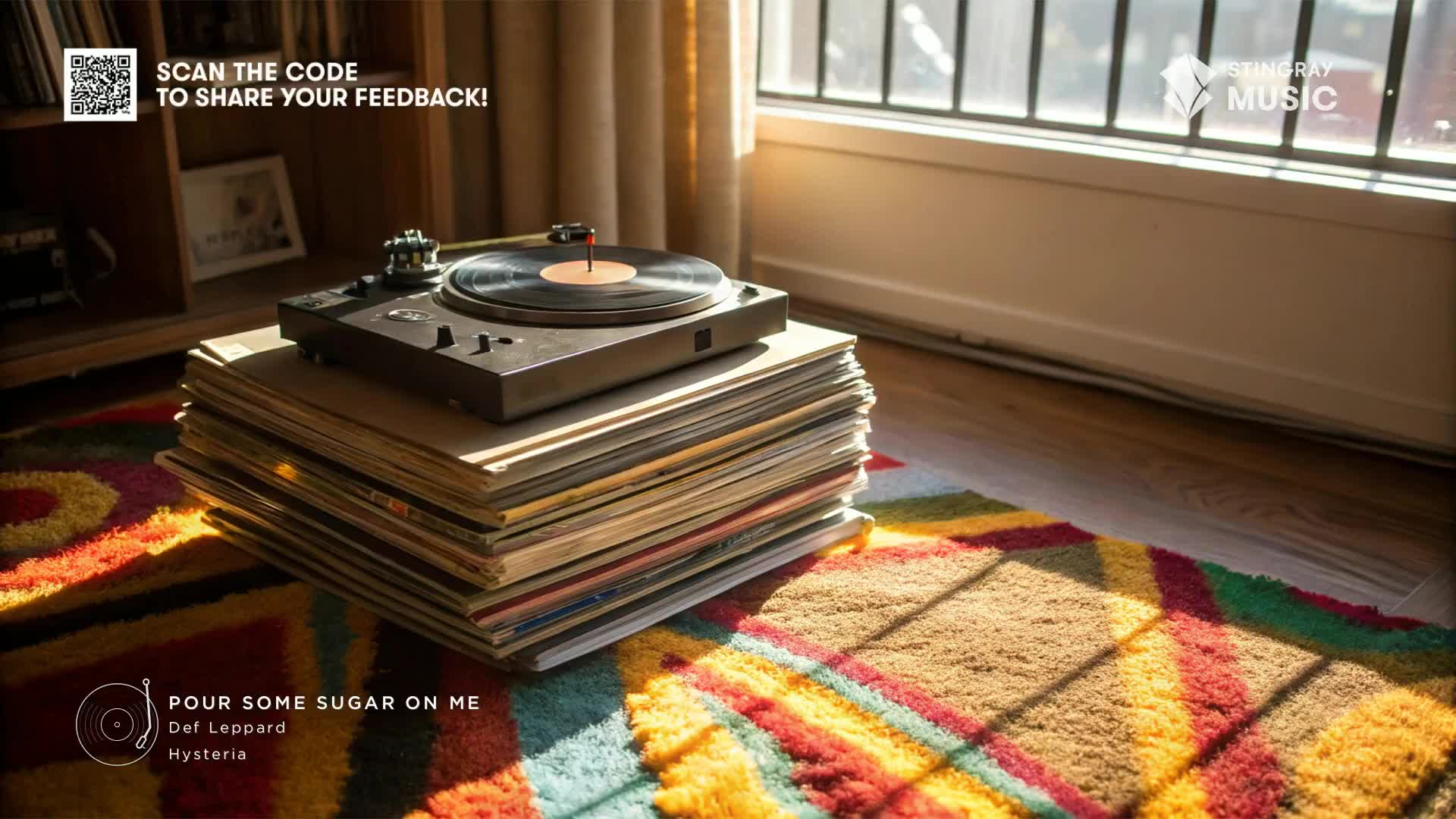 A turntable sits atop a stack of vinyl records, the needle resting on a disc. Sunlight streams through the window, illuminating the scene and the Stingray Music logo.
