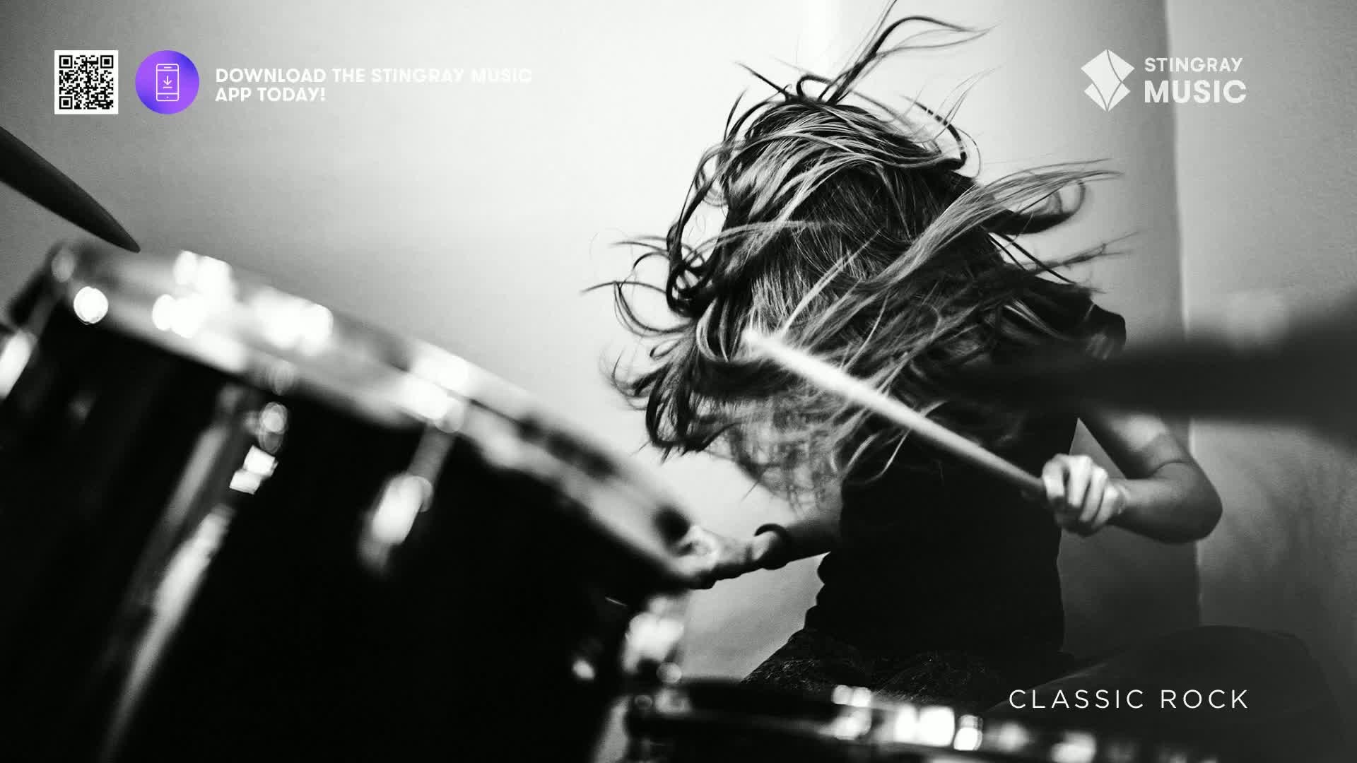 A drummer's hair whips around as they pound the snare, the sticks a blur against the drum's shiny surface. The energy of Stingray Classic Rock in Canada is captured in this moment of pure, unadulterated rhythm.
